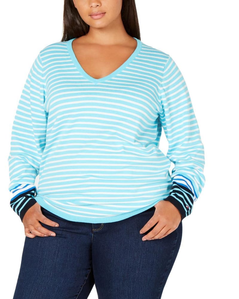 Front of a model wearing a size 1X Tommy Hilfiger Women's Plus Striped V-Neck Sweater Blue Size 1X in Blue by Tommy Hilfiger. | dia_product_style_image_id:314456